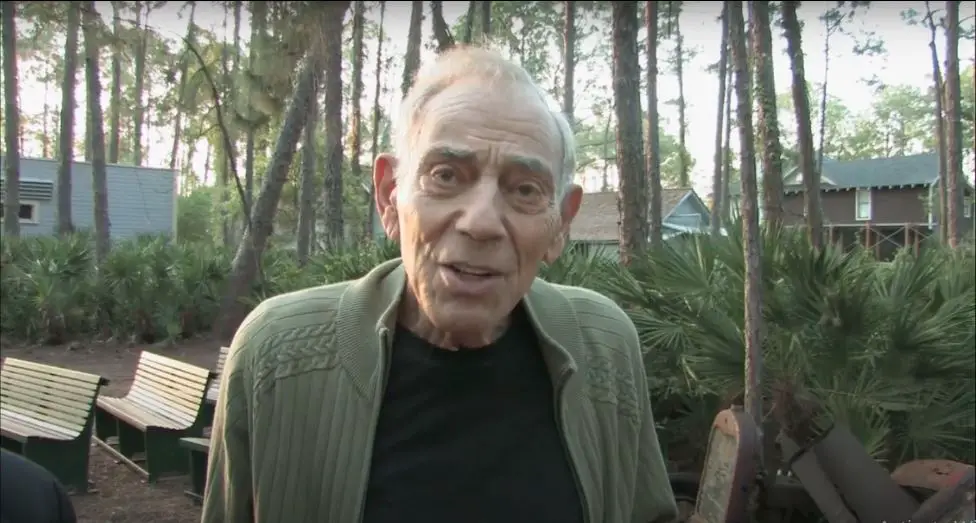 Herschel Gordon Lewis outside looking at the camera.