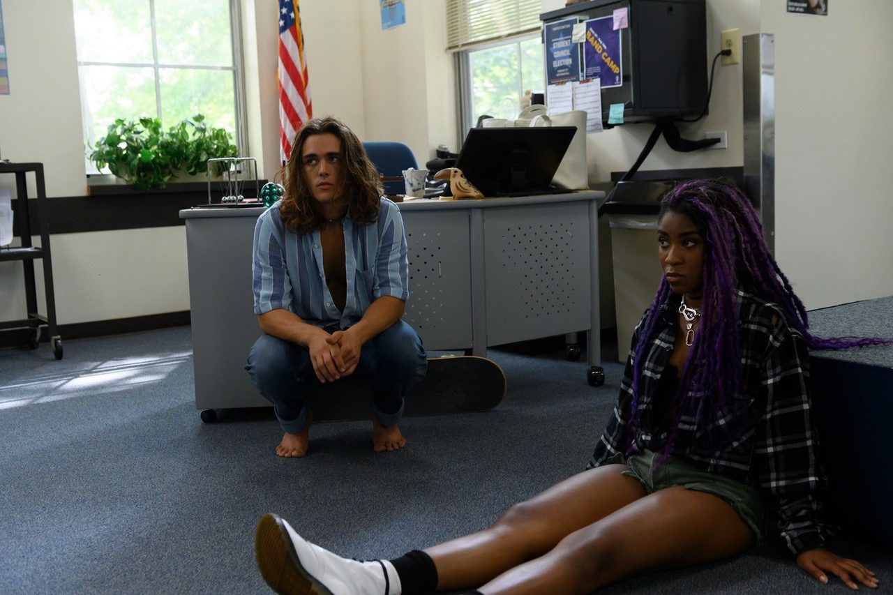 Two students sit on a classroom floor in "The Class"