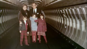 The Timoner family pose in the fuselage of one of their planes