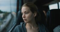 Jennifer Lawrence as Lynsay, riding the bus home from the hospital