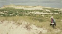 Zoe Lucas walks alone along the dunes of Sable Island