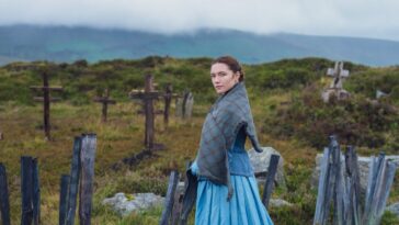 Florence Pugh's 'Lib' stands in a churchyard, surrounded by the famine dead