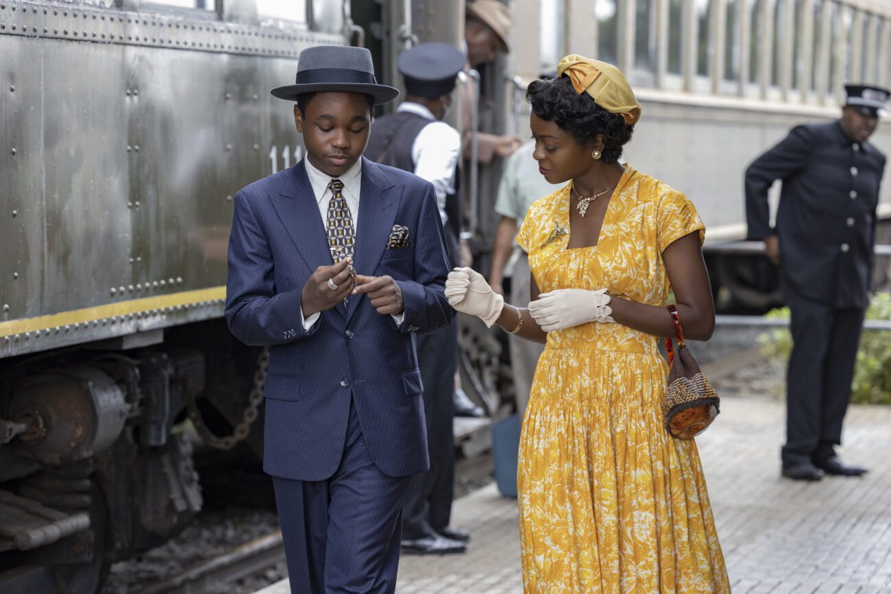 A son looks down at a gift from his mother on a train platform in "Till"