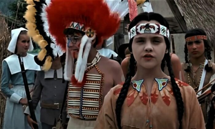 Christina Ricci and David Krumhotlz as stereotypical Native Americans in a bad play in the film Addams Family Values