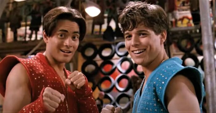 Mark Dacascos and Scott Wolf in red and blue karate outfits in the Double Dragon movie