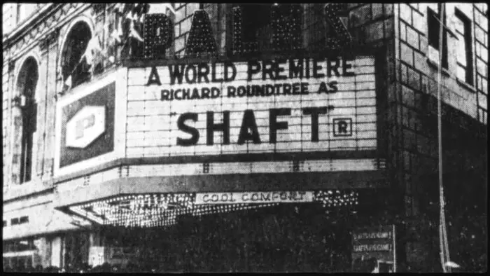 An archival photo of a movie marquee reading "A World Premiere: Richard Roundtree as Shaft."