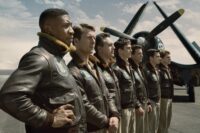 A line of pilots looks forward next to their planes in Devotion.