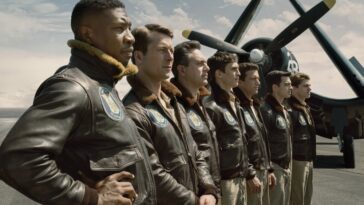 A line of pilots looks forward next to their planes in Devotion.