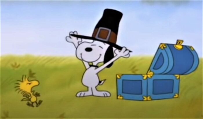 Peanuts characters Snoppy and Woodstock getting ready for Thanksgiving by dressing as Pilgrims in A Charlie Brown Thanksgiving