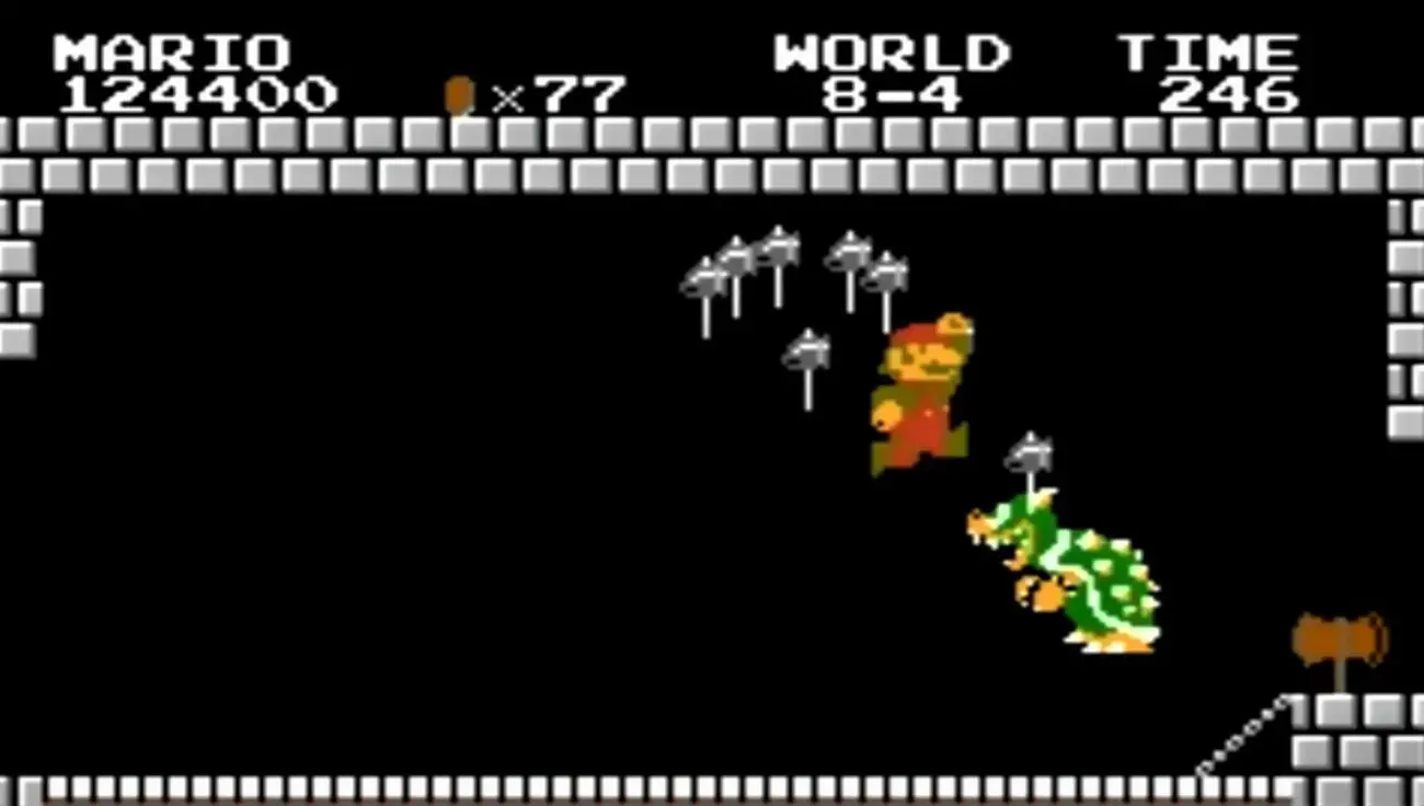 Mario and King Koopa battle on a bridge over lava at the end of the first Super Mario video game