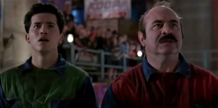 Bob Hoskins and John Leguizamo in their red and green overalls as Mario and Luigi in the Super Mario Bros movie from 1993