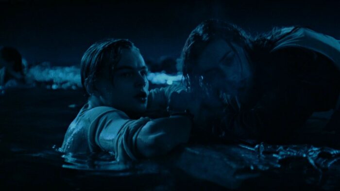 Two people are stuck in a freezing ocean at night in Titanic