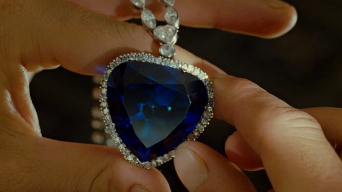 A heart-shaped blue diamond necklace.