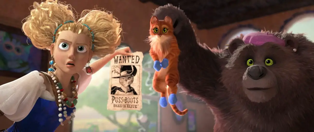 A woman holds up a wanted poster while a bear holds up a cat in Puss in Boots: The Last Wish.