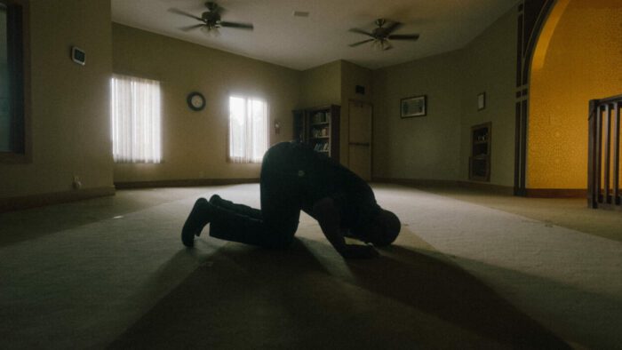 Jomo Williams prays in the Islamic Center of Muncie.