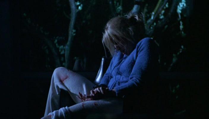 Misty holds her hand to her bleeding wrist.
