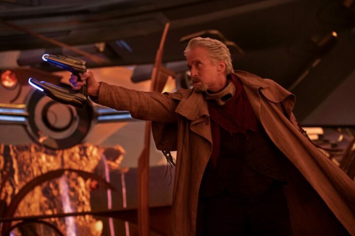 Hank Pym points a gun at an adversary.
