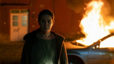 Cielo (Arcelia Ramírez) walks away from a burning car.