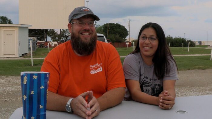Ben and Nora, owners of Harvest Moon Drive-in, sit at a picnic table