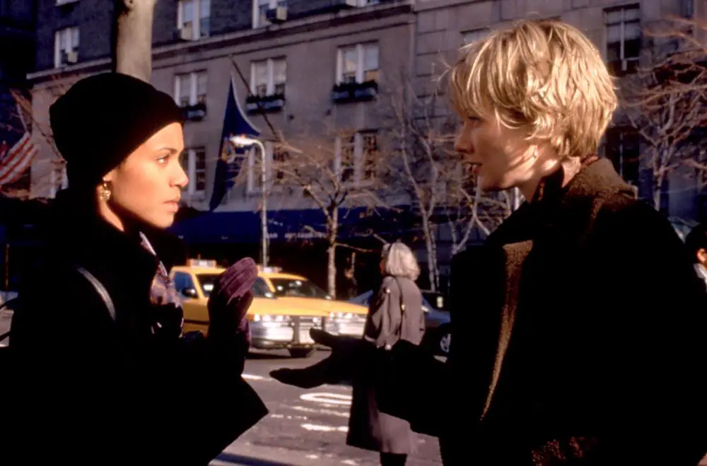 M.J. and Beth look at each other while in the streets of New York City.