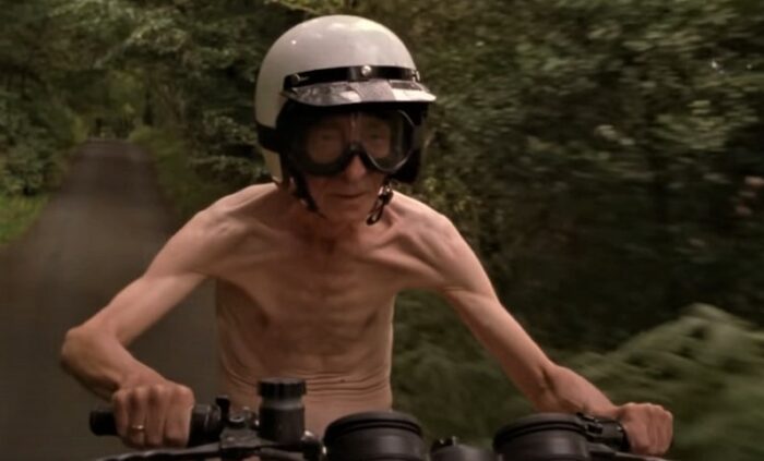 David Kelly as Michael O'Sullivan riding a motorcycle completely naked in Waking Ned Devine
