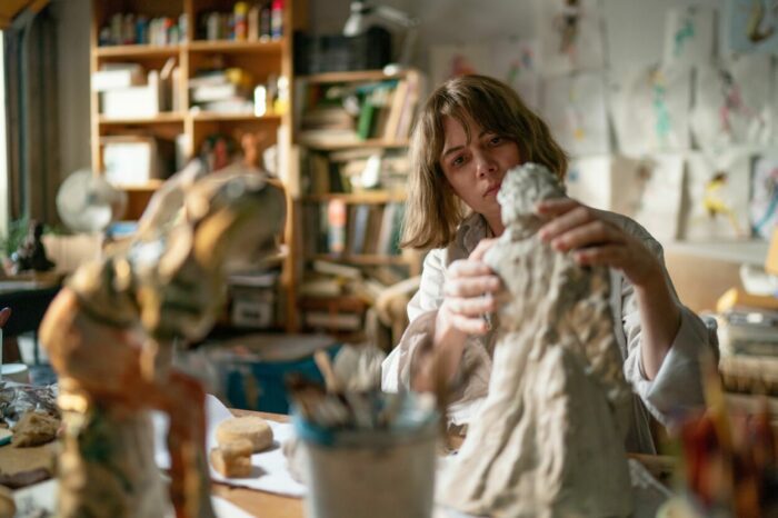 Lizzy in her studio, sculpting 