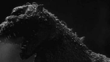 Godzilla in "Godzilla" roaring, showing a mouth full of spiked teeth.