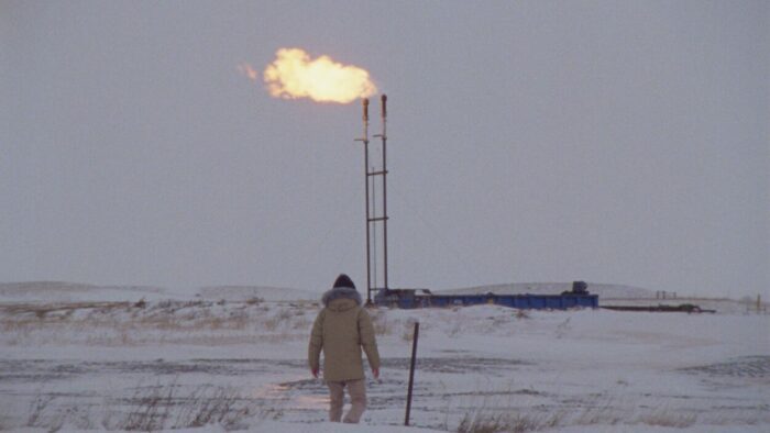 Michael (Forrest Goodluck) stands in the North Dakota snow faced with his enemy, an oil refinery burning in the distance