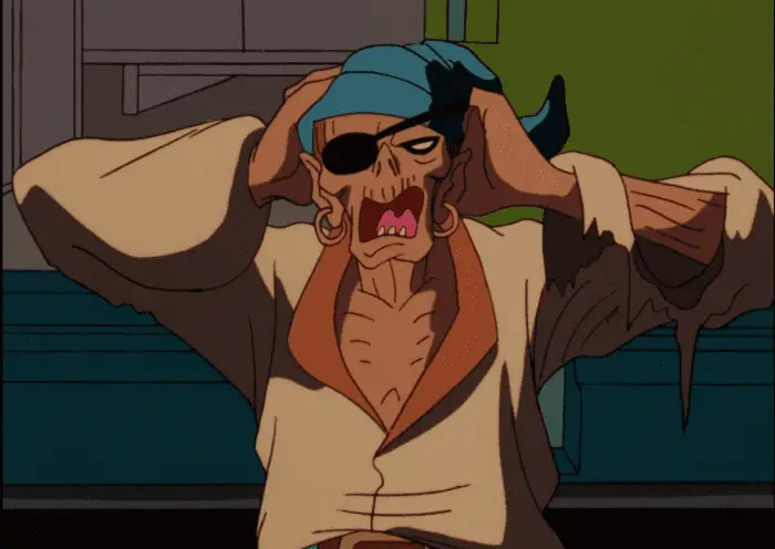 A zombie wearing pirate looking clothes, holding its head