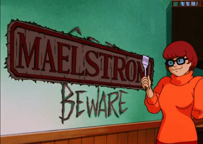 Velma holding a spatula, next to the words "Maelstrom" and "Beware"