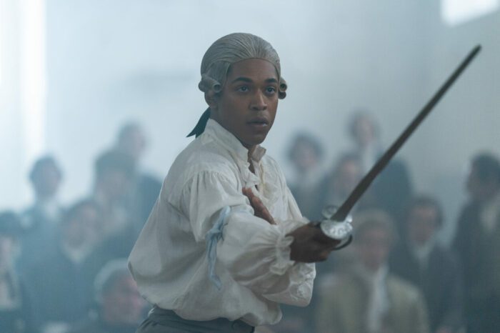 Kelvin Harrison Jr. in the film CHEVALIER, sword in hand and ready to fight. Photo by Larry Horricks. Courtesy of Searchlight Pictures. © 2023 20th Century Studios All Rights Reserved.