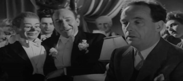 dream scene from dead of night, featuring a ventriloquist's dummy apparently taunting a troubled man