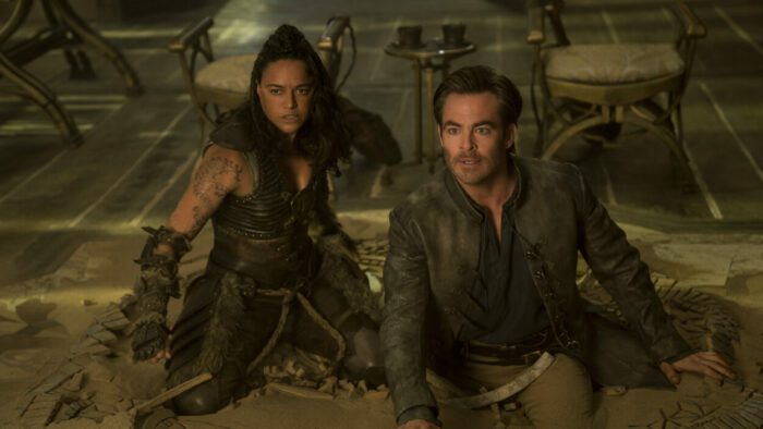 Chris Pine plays Edgin and Michelle Rodriguez plays Holga crouching out of sight preparing to attack