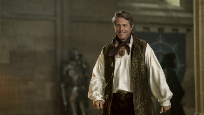 Hugh Grant plays Forge smiling in his fortress
