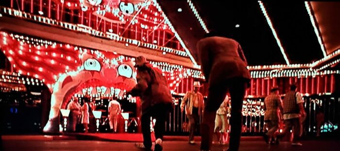 Johnny Depp and Benicio del Toro stumbling into the Bazooko Circus in Fear and Loathing in Las Vegas