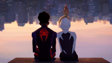 Miles and Gwen sit while the city is upside down in front of them during the evening.