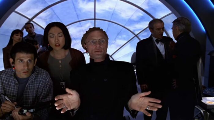 Christof and his crew watch an off-screen monitor in The Truman Show