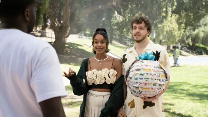 A young couple arrives at a party with wrapped gifts in White Men Can't Jump