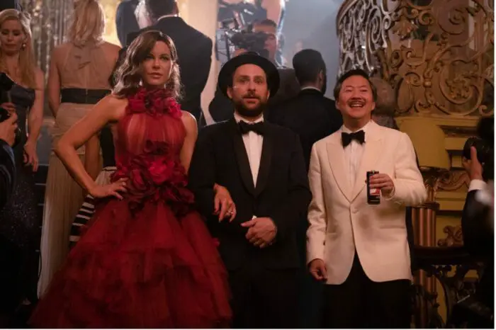 Kate Beckinsale, Charlie Day, and Ken Jeong dressed in high fashion during a red carpet scene in Fool's Paradise, courtesy of Roadside Attractions.