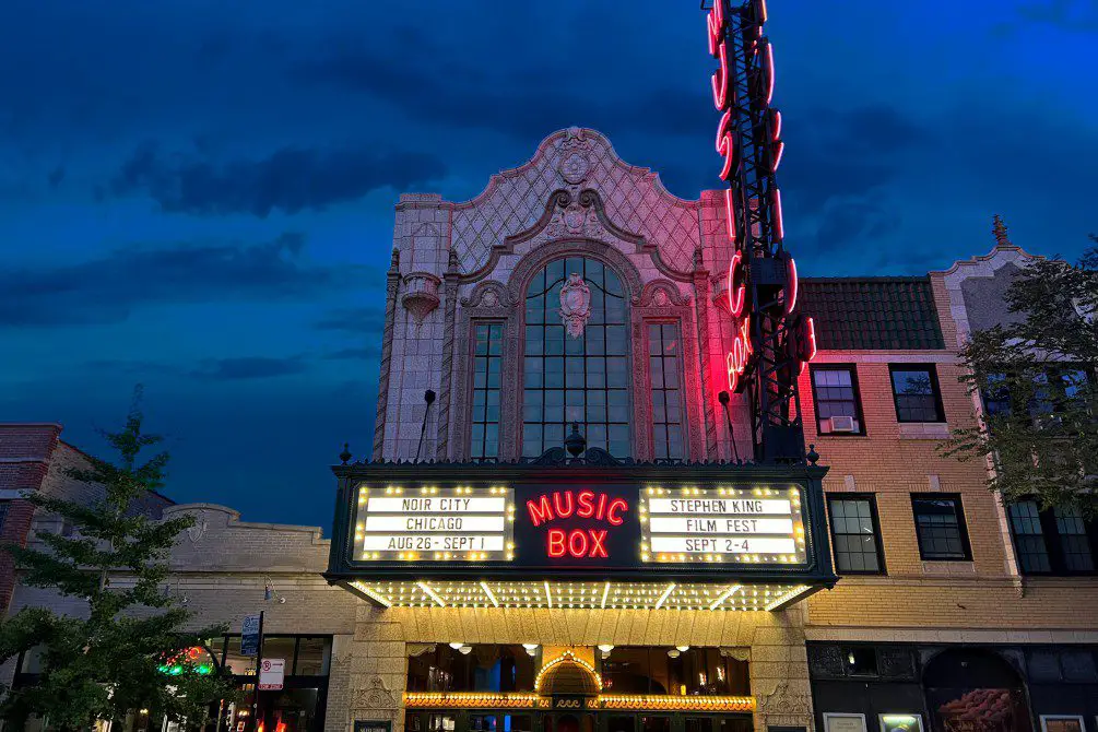 The bright marquee of the Music Box Theatre during nighttime.