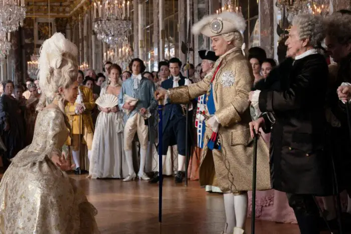 Madame du Barry (Maiwenn) greets King Louis XV (Johnny Depp) at court