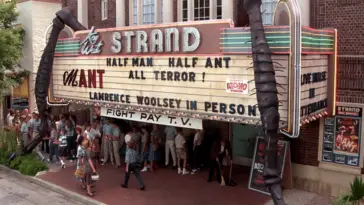 A theater marquee advertises the movie Mant!