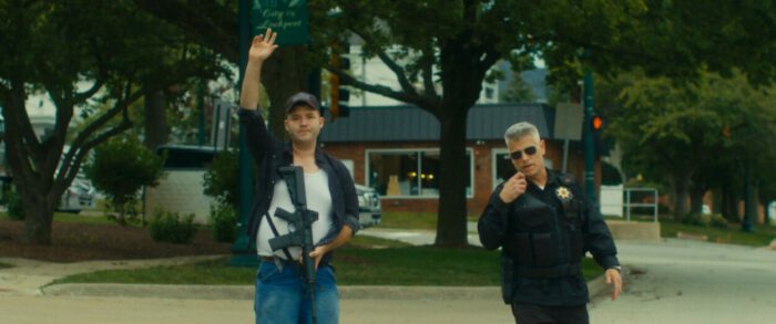 David Stobbe and Roger Welp as Cade and Officer Kruegher in Good Guy with a Gun (2023)