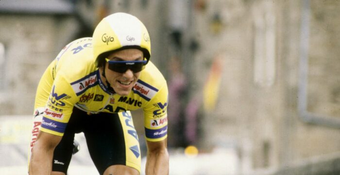 Greg LeMond rides in the Tour de France, wearing his aerodynamic helmet.