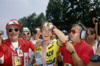 Greg LeMond celebrates at the Tour de France.