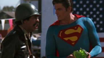 Superman accepts a gift from a pretend general.