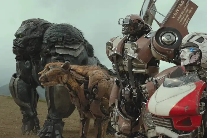 From left to right; Optimus Primal, Cheetor, Wheeljack, and Arcee looking off to the left at something.