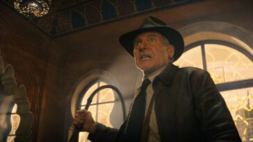 A man in a fedora brandishes a whip in Indiana Jones and the Dial of Destiny