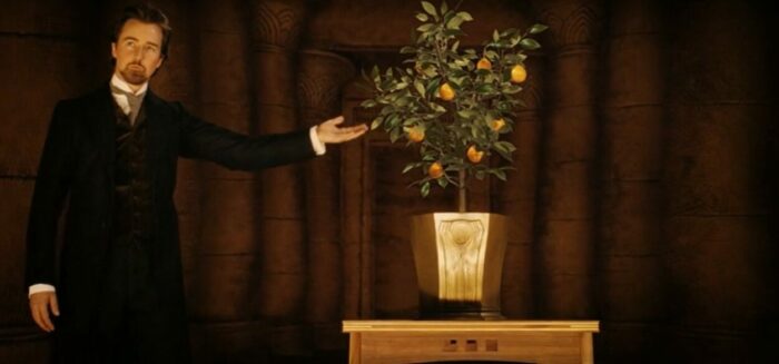 Edward Norton in the role of Eisenheim conjuring up the orange tree in film The Illusionist