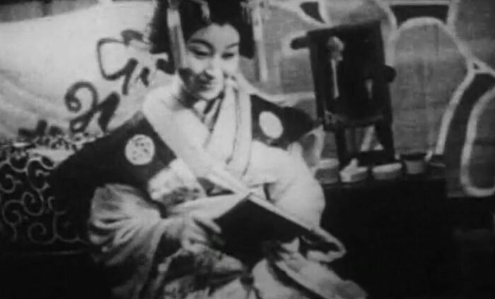 Takako Irie with a book in the role of Taki in film The Water Magician